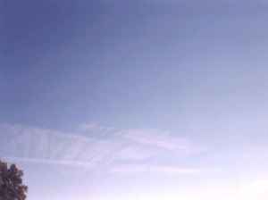 What the contrails look like after they've spread out and travelled a ways...